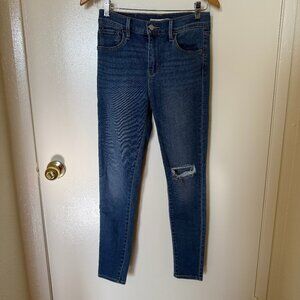 Levi’s 720 High Rise Super Skinny Distressed Knee Denim Jeans In Dark Blue Wash